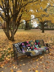 park bench with a blanket