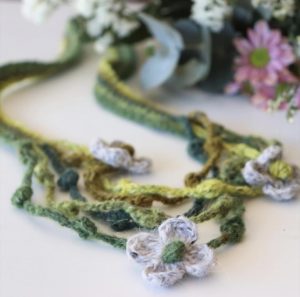 close up photo of crochet necklace