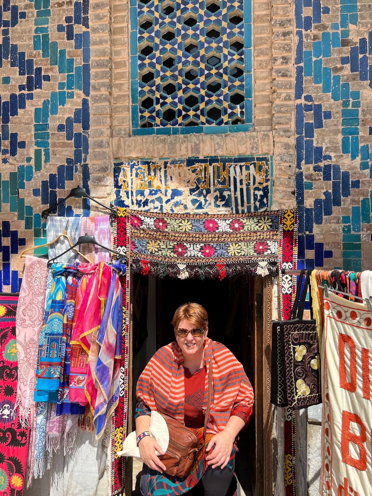 tour guide Nicole standing in a textile stall