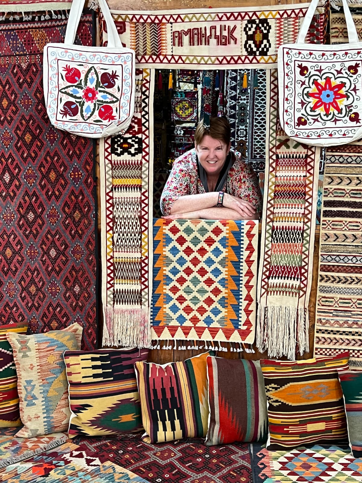 Tour guide Nicole in amongst woven blankets